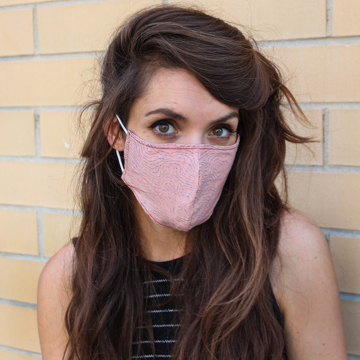 handmade double-sided face mask with filter pocket in pink for covid 19 on female model