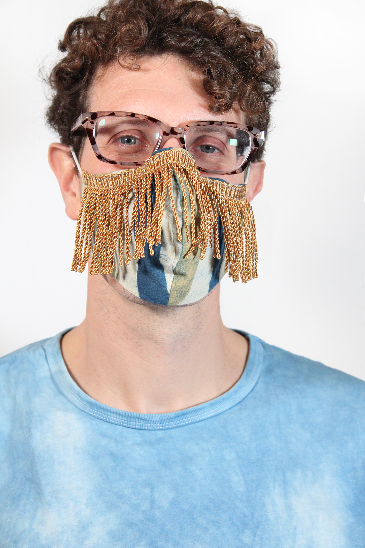Face covering mask with Gold fringe on male model