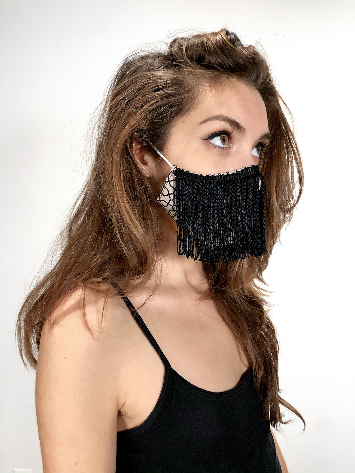 Face covering mask with Black fringe on female model